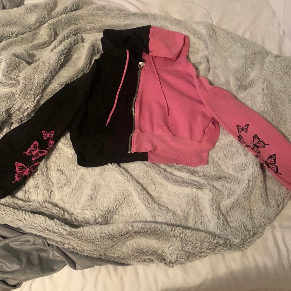 a butterfly cropped zip up